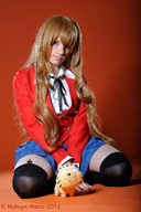 collage blonde brown_eyes sitting manicure looking_at_viewer miniskirt blue_skirt hosiery mallegni_marco in_hosiery