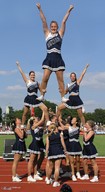 collage mini_giantess outdoors skirts cheerleaders arms_raised cheering human_pyramid