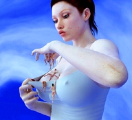 nude feet handheld cleavage green_eyes red_hair shrunken_woman freckles manicure hanging_on white_top looking_at_tiny digital_render flagg3d between_breasts