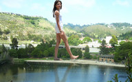giantess landscape beach barefoot buildings brunette walking people looking_at_viewer imminent_crush lowerrider