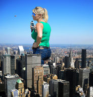 city mega blonde buildings helicopter jeans skyscraper sunglasses cell_phone