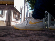 collage jeans sitting unaware shrunken_man sneakers outdoors peque nike
