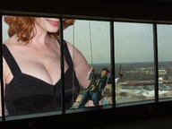 breasts giantess collage cleavage huge_breasts smiling red_hair window christina_hendricks
