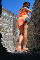 giantess collage long_hair barefoot brunette sandals shorts looking_back canyon