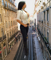 giantess collage black_hair large_breasts cleavage black_pants denise_milani pedestrians balcony city_street sunshine looking_in thigh_boots apartment_building potted_plants rails