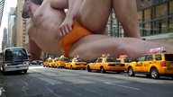 collage city giant penis buildings lying_down bus pedestrian taxi_cabs briefs looking_off_in_the_distance