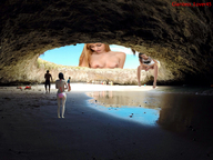 nipples gentle giantess butt swimsuit high_heels multiple_sizes smiling mini_giantess sitting looking_down giantesses cave sky nipple_piercing