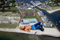 giantess collage blonde beach water buildings jeans wonderslug lying_down sand boats downward_angle elsa_hosk