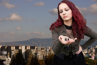 giantess collage handheld buildings red_hair hand palm mountains sky marcrtr looking_at_tiny amarie-tinuviel