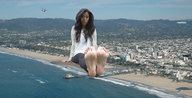 giantess collage city mega black_hair beach barefoot helicopter sitting looking_at_viewer lowerrider