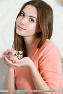 gentle collage long_hair blue_eyes clothed brunette shrunken_man looking_at_viewer coffee_cup pink_sweater
