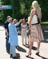 gentle blonde long_hair clothed skirt high_heels red_hair amazon pants onlookers