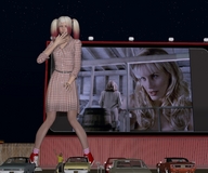 gentle giantess blonde long_hair clothed dress twintails ponytails standing vehicles sneakers movie night fence stars drive_in_theater attack_of_the_50_foot_woman digital_render nancy_archer darryl_hannah drive_in