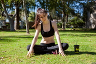 gentle giantess nude sitting shrunken_man outdoors looking_at_viewer sports_bra