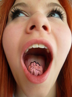 collage nude tongue teeth smiling lips red_hair sitting shrunken_woman open_mouth nose crouching point_of_view looking_at_viewer huddled