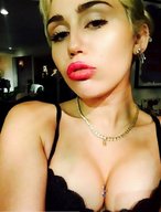 collage cleavage unknown_artist shrunken_man necklace looking_at_viewer miley_cyrus between_breasts