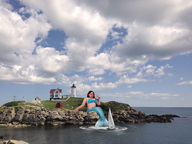 giantess collage beach ocean mermaid wonderslug sitting lighthouse clouds sky rocks sailboat fins arkannes tale-of-a-sea-goddess