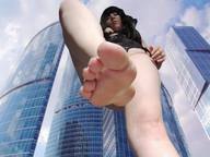 giantess feet toes barefoot buildings soles legs looking_down skyscraper photograph sky point_of_view looking_at_viewer raised_foot perspective imminent_crush