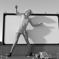 gentle giantess blonde monochrome clothed shoes posing legs runswithferrets screen digital_render sweater_dress drive-in_theatre classic_car garbage