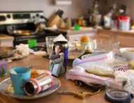 collage jeans brunette sitting medium_length_hair table shrunken_woman looking_up indoors messy curled_up jacket sad zboczony