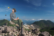 giantess collage brunette asian short_hair sitting mountains coffee smoke outdoors hot_air_balloon looking_back airraid