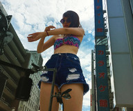 bikini giantess collage city black_hair long_hair clothed buildings asian shorts sunglasses standing airraid