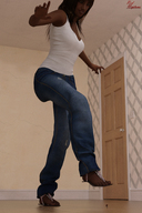 black_hair long_hair jeans sandals shrunken_man looking_down dark_skin indoors top raised_foot running_away red-neptune