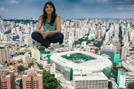 giantess collage long_hair clothed jeans brunette smiling stadium sitting top looking_at_viewer brazil