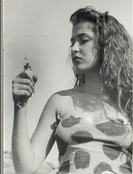 giantess collage monochrome long_hair handheld brunette looking_down ripped_clothing
