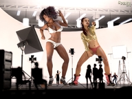 bikini giantess cleavage giantesses dark_skin indoors spawngts digital_render music_video bare_legs bare_midriff gold_jacket studio_setting