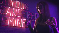 handheld brunette shrunken_woman shrunken_man mask gag dominatrix submissive alley sorenzer0 digital_render leather_clothing neon_sign