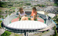 giantess collage black_hair long_hair destruction skirt brunette stadium asian sitting shorts sunglasses giantesses kyojingirls