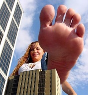 collage city mega blonde long_hair clothed barefoot cleavage buildings smiling looking_down imminent_crush gt647