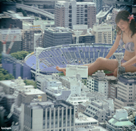 bikini giantess collage city black_hair long_hair barefoot buildings stadium asian sitting navel looking_down ponytails onlookers kyojingirls