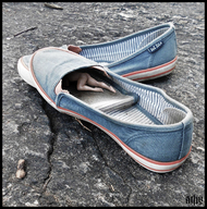 collage butt barefoot shoes in_shoe lying_down shrunken_man naked_man digital_render up_close starkadhr