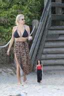 collage blonde large_breasts long_hair beach barefoot skirt unknown_artist walking shrunken_woman sand outdoors bikini_top