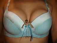 collage bra lying_down shrunken_man between_breasts sfxhh3