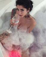 collage black_hair bath smiling short_hair unknown_artist sitting shrunken_man tattoo wine_glass soapy on_breasts