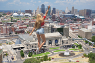 giantess collage city long_hair clothed traffic buildings shorts walking vehicles outdoors waving