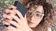 giantess city mega long_hair handheld buildings glasses brunette smiling looking_up freckles boomgts digital_render