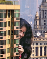 giantess collage city long_hair clothed buildings smiling dark_skin outdoors chainorchid