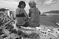 bikini giantess collage city monochrome clothed beach buildings sitting giantesses outdoors looking_back chainorchid