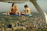giantess collage city blonde long_hair clothed buildings brunette ponytail looking_down giantesses outdoors discarded_clothing chainorchid