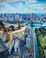 bikini giantess collage city mega black_hair long_hair lying_down outdoors kyoujingirls