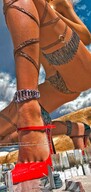 giantess mega color high_heels topless kneeling clouds outdoors sky construction_site semi_nude digital_render bare_midriff velocity-vektor