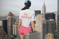 collage city mega black_hair color clothed buildings shorts outdoors sky hat new_york_city docop empire_state_building rear_view bare_legs