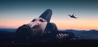 giantess collage giga mega color destruction clothed military smiling lying_down mountains bodysuit leather latex night sunset catsuit looking_at_viewer glowing_eyes leather_clothing smirking ia-r-d