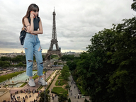 gentle giantess collage black_hair long_hair clothed asian standing onlookers paris cellphone ripped_clothing eiffel_tower