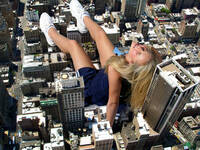 giantess collage city blonde buildings unknown_artist sitting skyscraper sneakers white_sneakers