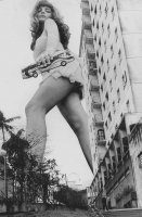 breasts giantess collage city mega monochrome long_hair handheld bra skirt buildings bus stairs edison palm_trees point_of_view bare_legs looking_at_tinies